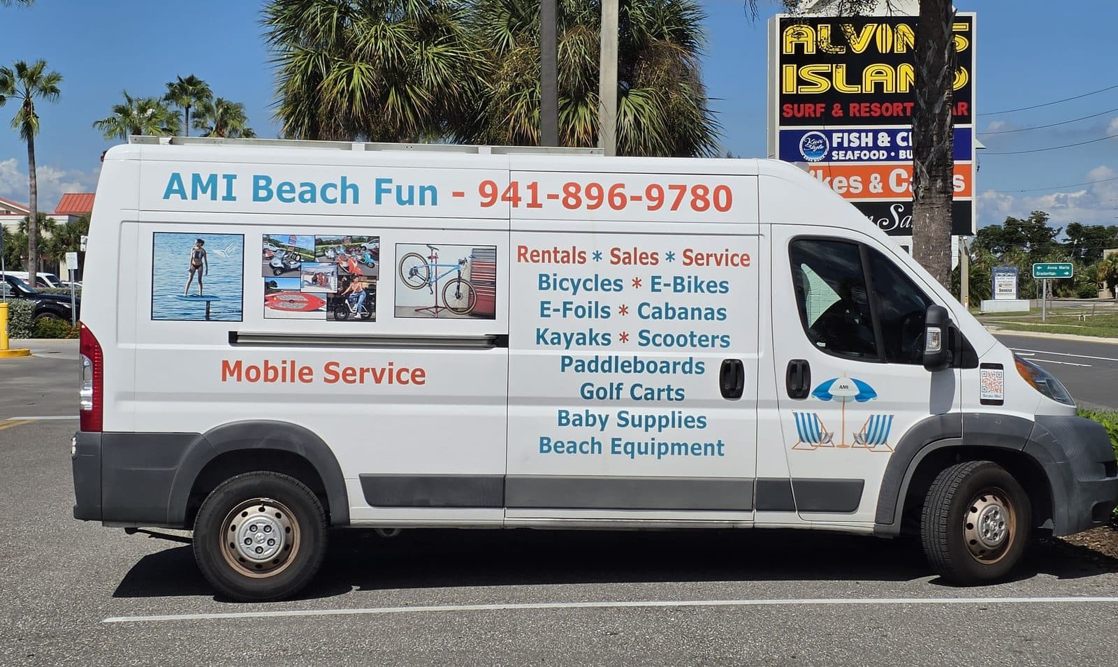 The white AMI Beach Fun mobile service van listing bikes, e-bikes, kayaks and beach gear